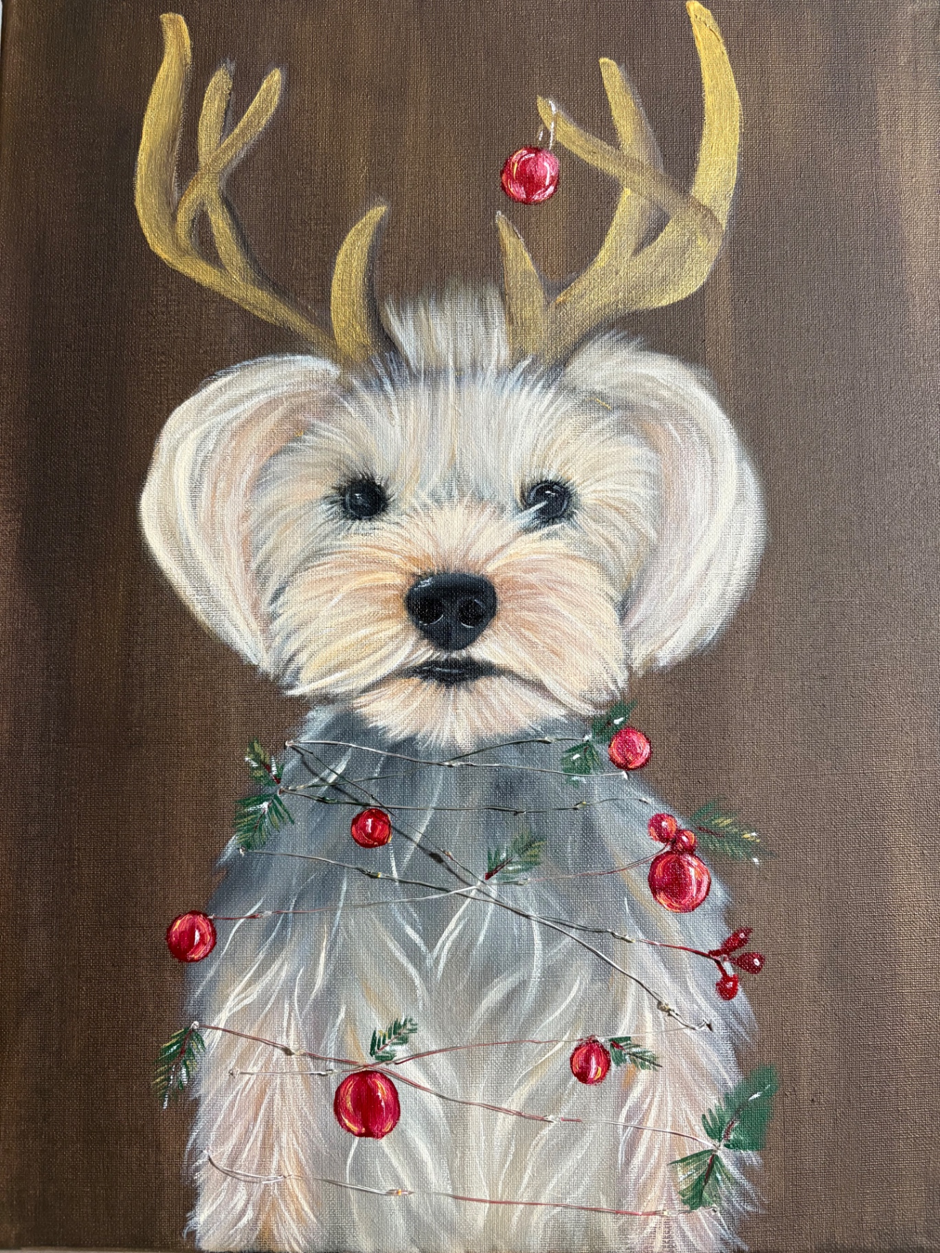 Close-up of Zeytin's Christmas portrait with golden antlers