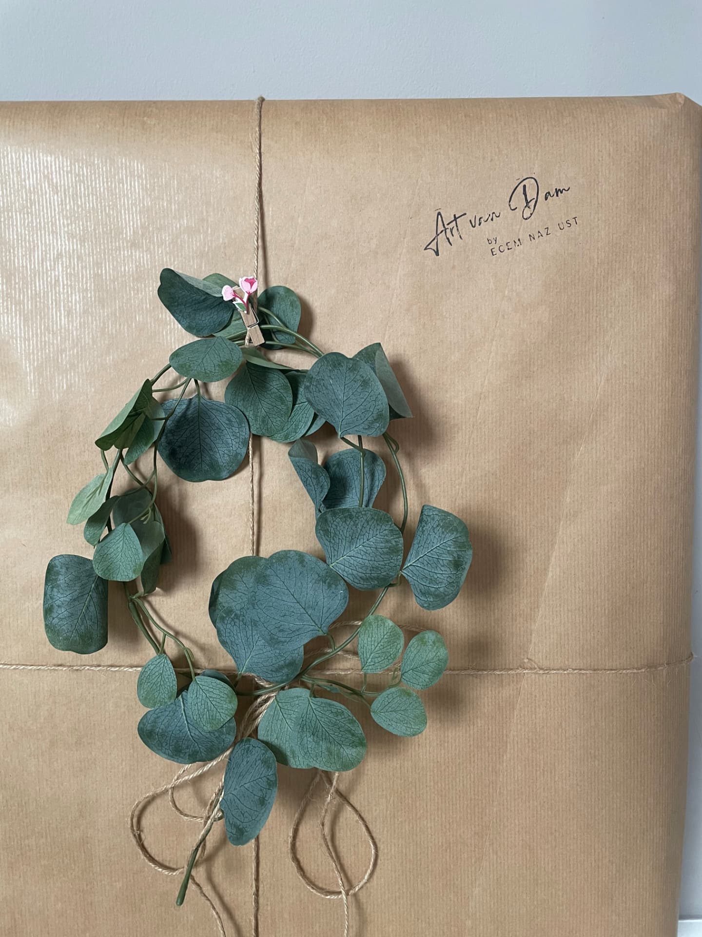 Wrapped oil painting with eucalyptus branches and the Art van Dam signature